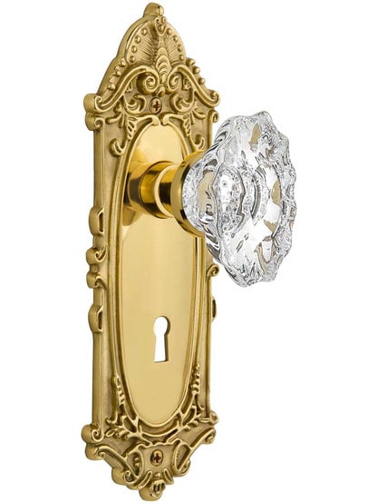 Largo Door Set with Keyhole and Chateau Crystal Glass Knobs in Un-Lacquered Brass.